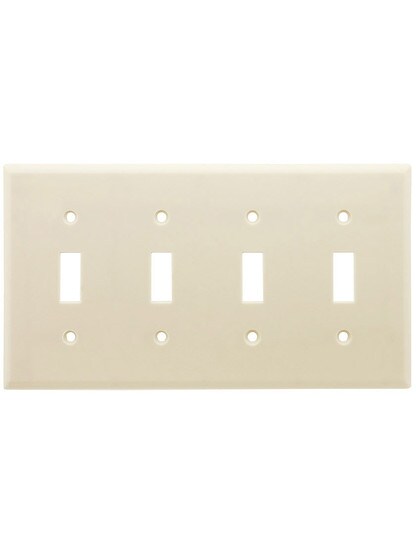 Leviton Quad Toggle Cover Plate in Light Almond.